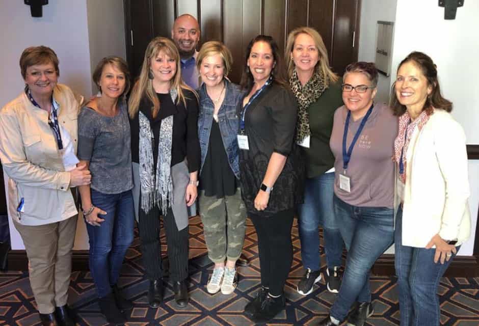 Group of Dare to Lead workshop participants standing together after a session